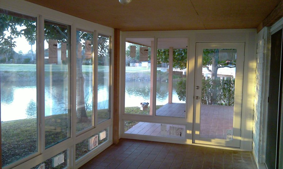 floor to ceiling windows and doors to balcony deck